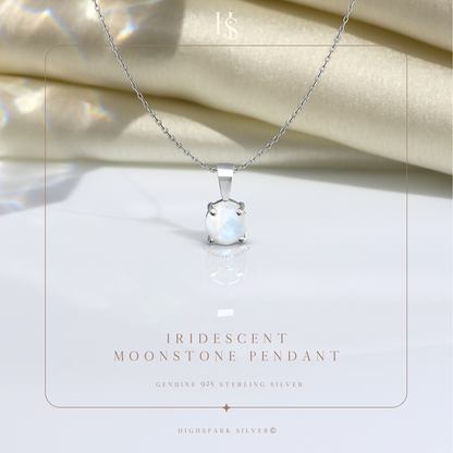 A sterling silver pendant necklace with a round iridescent moonstone in a four-prong setting.