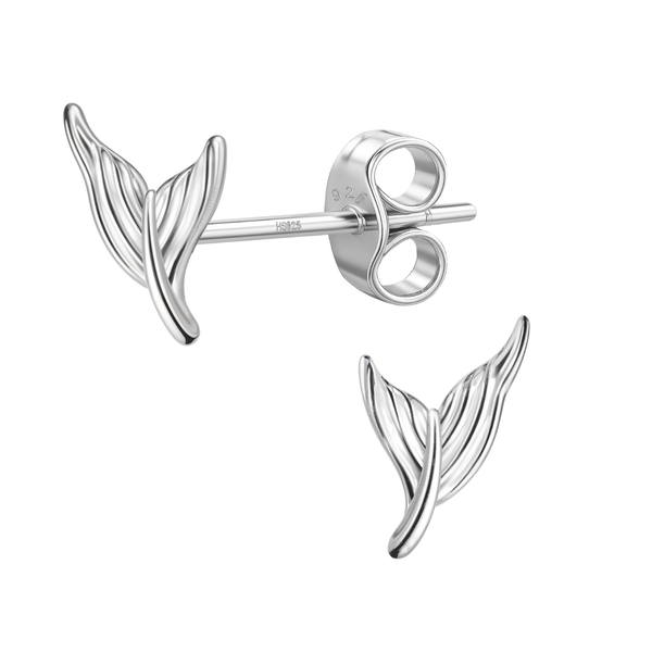 A pair of sterling silver stud earrings shaped like sculpted mermaid fins, with one showing its push back closure, on a white background.