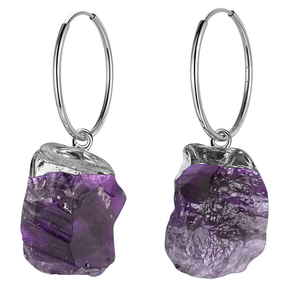 A pair of sterling silver hoop earrings with dangling raw, rough-cut purple amethyst gemstones in a textured silver cap setting.