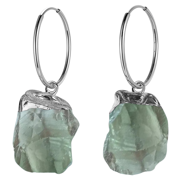 A pair of hoop earrings with raw, uncut green amethyst gemstone charms in a sterling silver setting, shown on a white background.