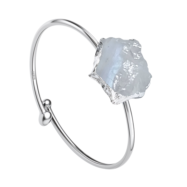 An adjustable sterling silver ring with a rough-cut, natural moonstone in a bezel setting, shown on a plain white background.