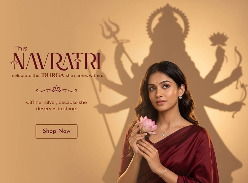 Navratri silver jewellery gift - 925 sterling silver lotus pendant, woman in maroon saree with lotus before a Durga silhouette