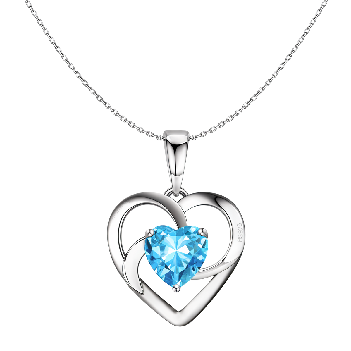 A sterling silver pendant necklace with an open heart frame holding a three-prong set, heart-shaped blue stone on a white background.