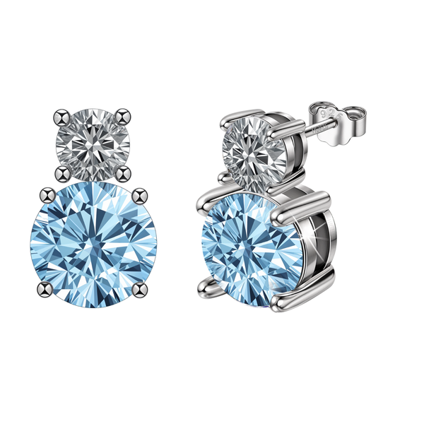 Sterling silver stud earrings with a round American diamond stacked above a larger, round light blue stone in a four-prong setting.