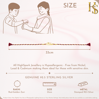 An 18K gold-plated 925 sterling silver rakhi for brother with a 'Bhai' motif on a red and golden zari thread, shown on a pink background.