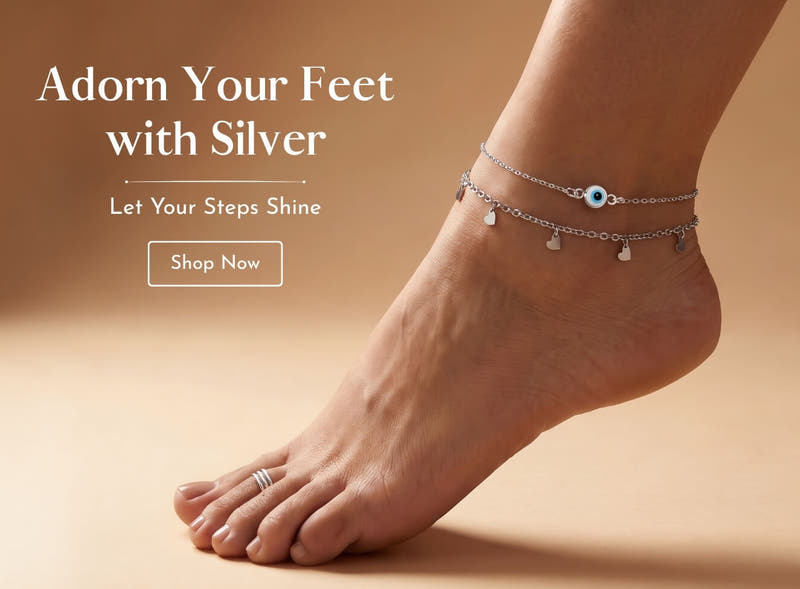 Silver anklets - 925 sterling silver evil eye and heart charm layered anklets worn on an ankle, with a silver toe ring