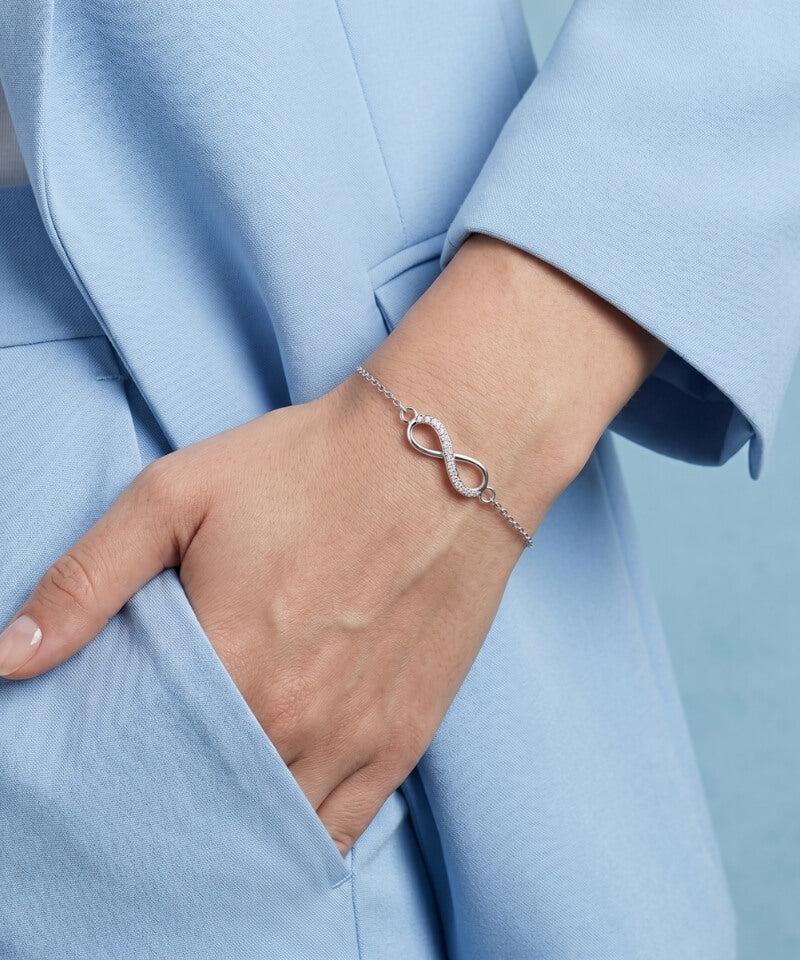 Sterling silver infinity bracelet worn on the wrist