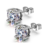 A pair of classic solitaire stud earrings for men, featuring round American diamonds in a four-prong setting of polished 925 sterling.