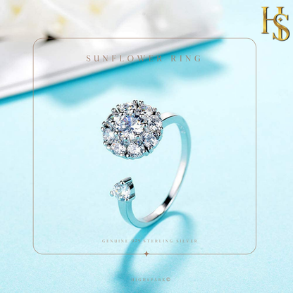 An adjustable sterling silver ring with a sunflower-shaped American diamond cluster and a single stone on the other end.