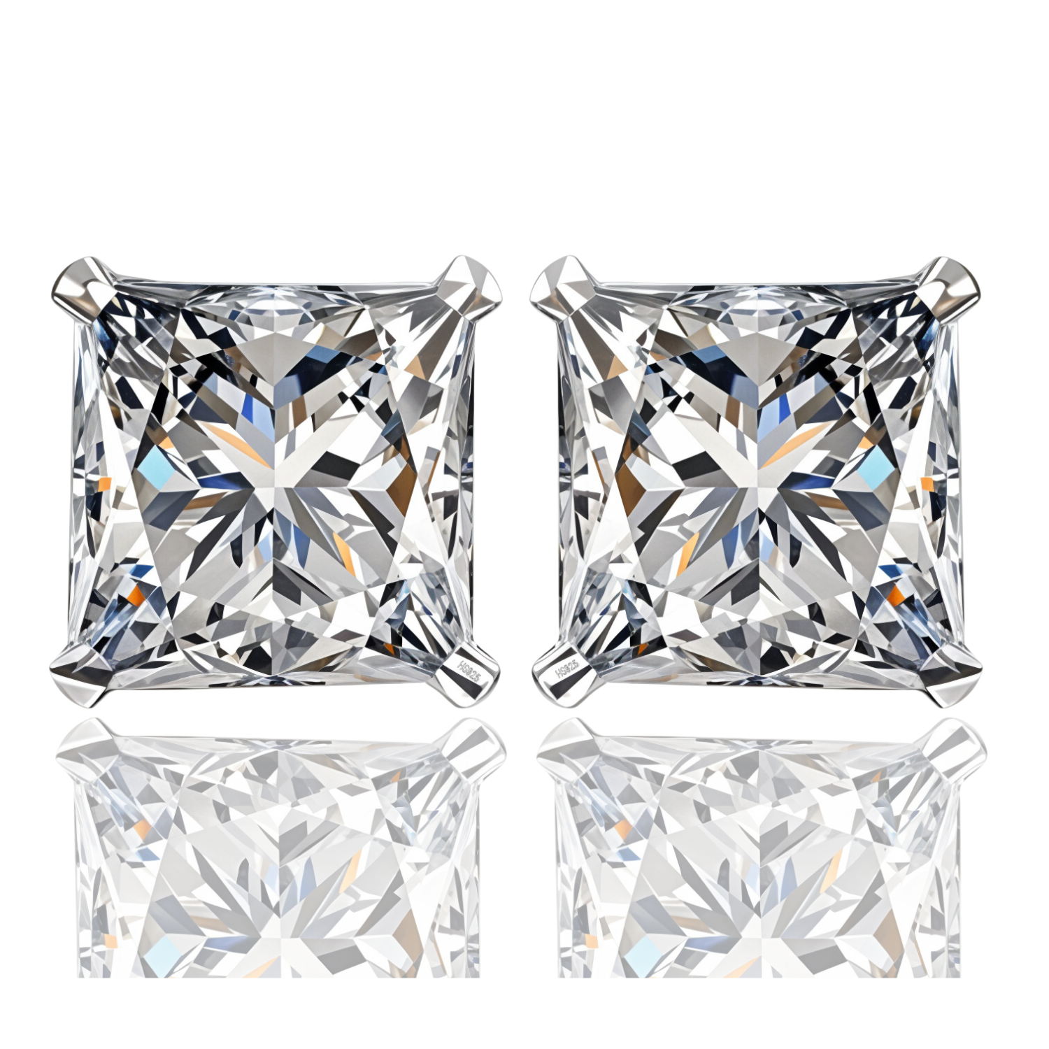 A pair of stud earrings with princess-cut American diamonds in a four-prong sterling silver setting, shown on a white reflective surface.