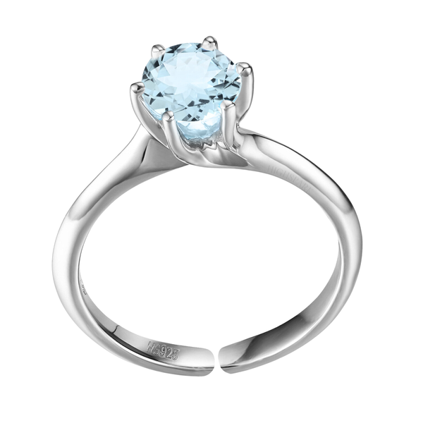 An adjustable solitaire ring with a round blue topaz gemstone in a six-prong setting on a sterling silver band, shown on a white background.