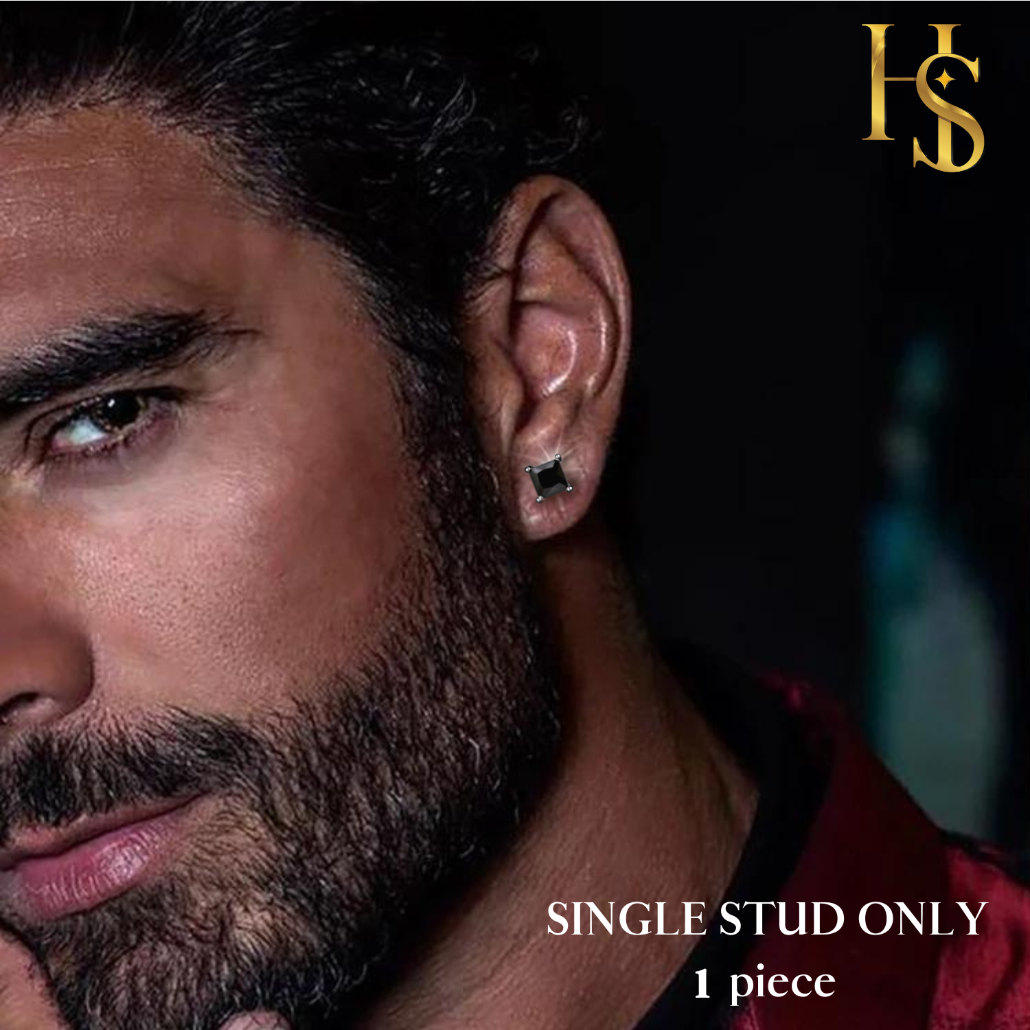 A single square-cut black stone stud earring in a four-prong sterling silver setting, worn on a man's ear.
