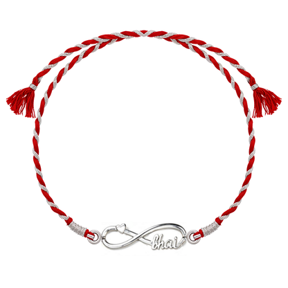 A 925 sterling silver rakhi for brother with an infinity knot, heart, and 'bhai' motif on a red and silver braided thread.