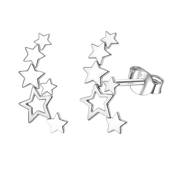 A pair of sterling silver ear climber stud earrings with a trailing cluster of solid and open star shapes on a white background.