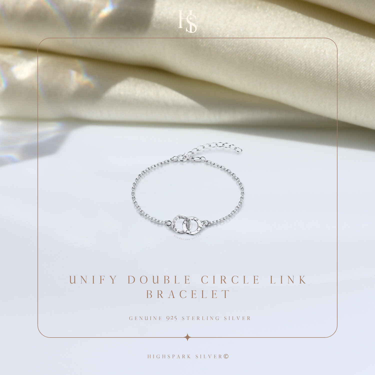 A sterling silver link bracelet with two interlocking circles, one paved with American diamonds.