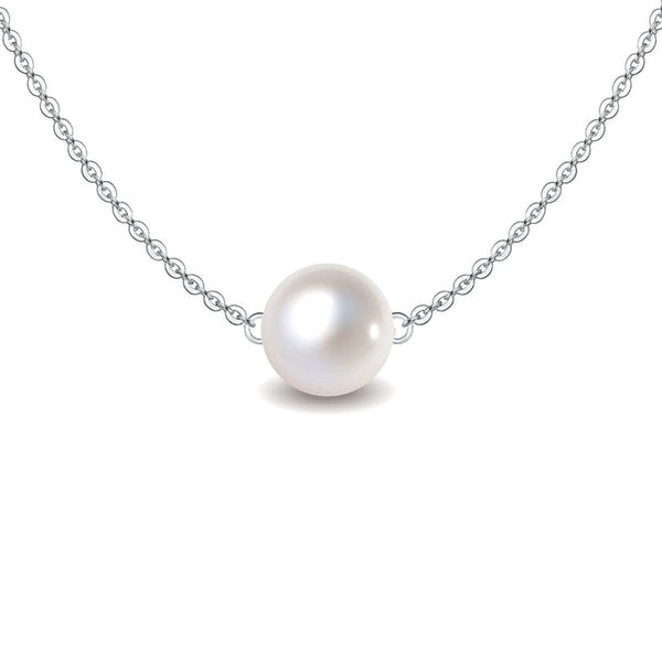 A classic pearl pendant necklace features a single round white pearl floating on a delicate sterling silver chain against a white.