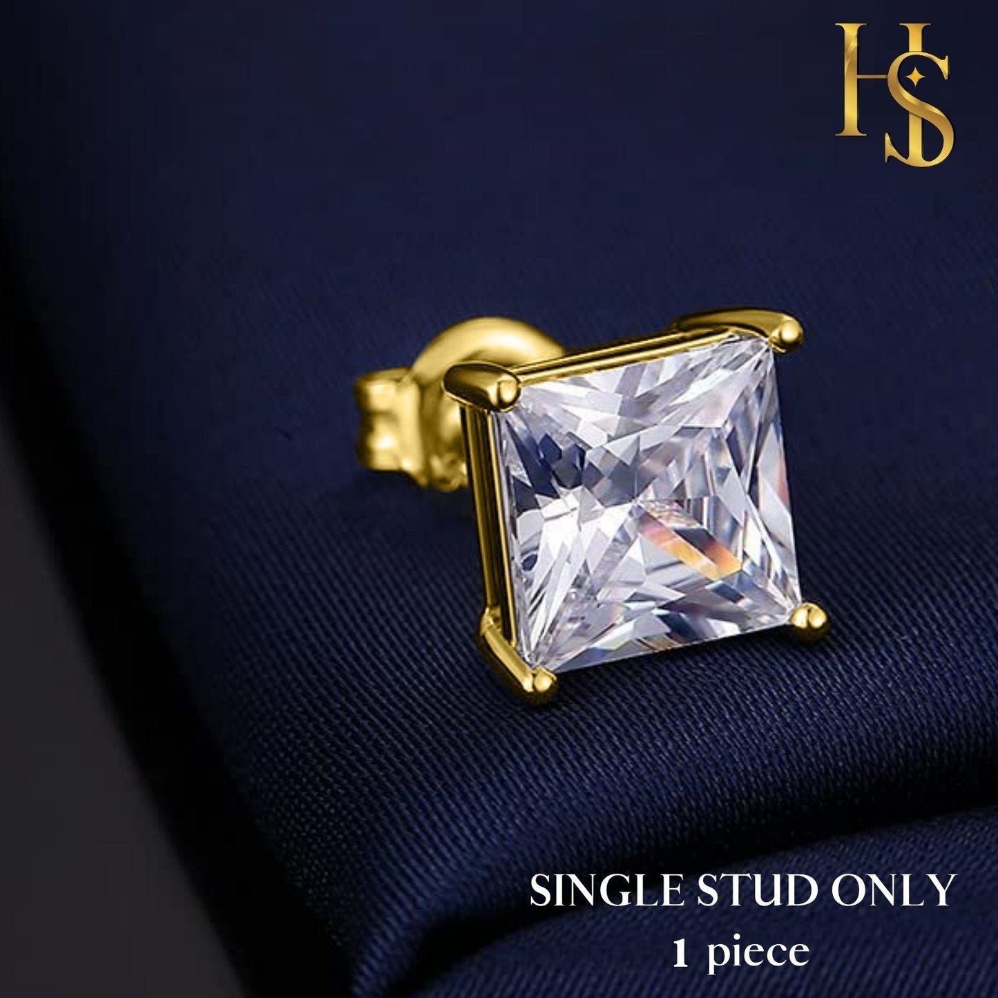 A single gold-plated stud earring with a square-cut American diamond in a four-prong setting, styled on a textured navy blue fabric.